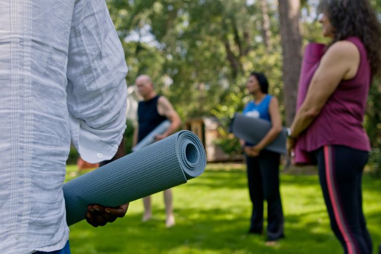 Group of people performing holistic therapy at drug and alcohol rehab