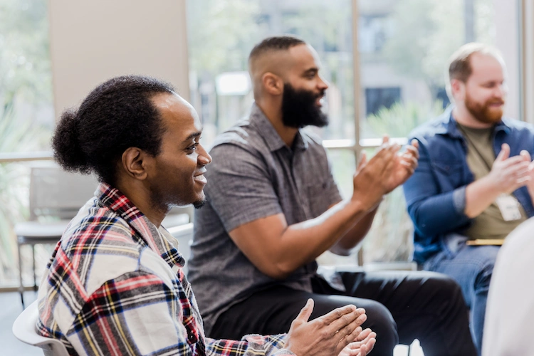 people supporting one another in a rehab group